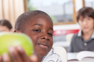 Boy sharing a apple